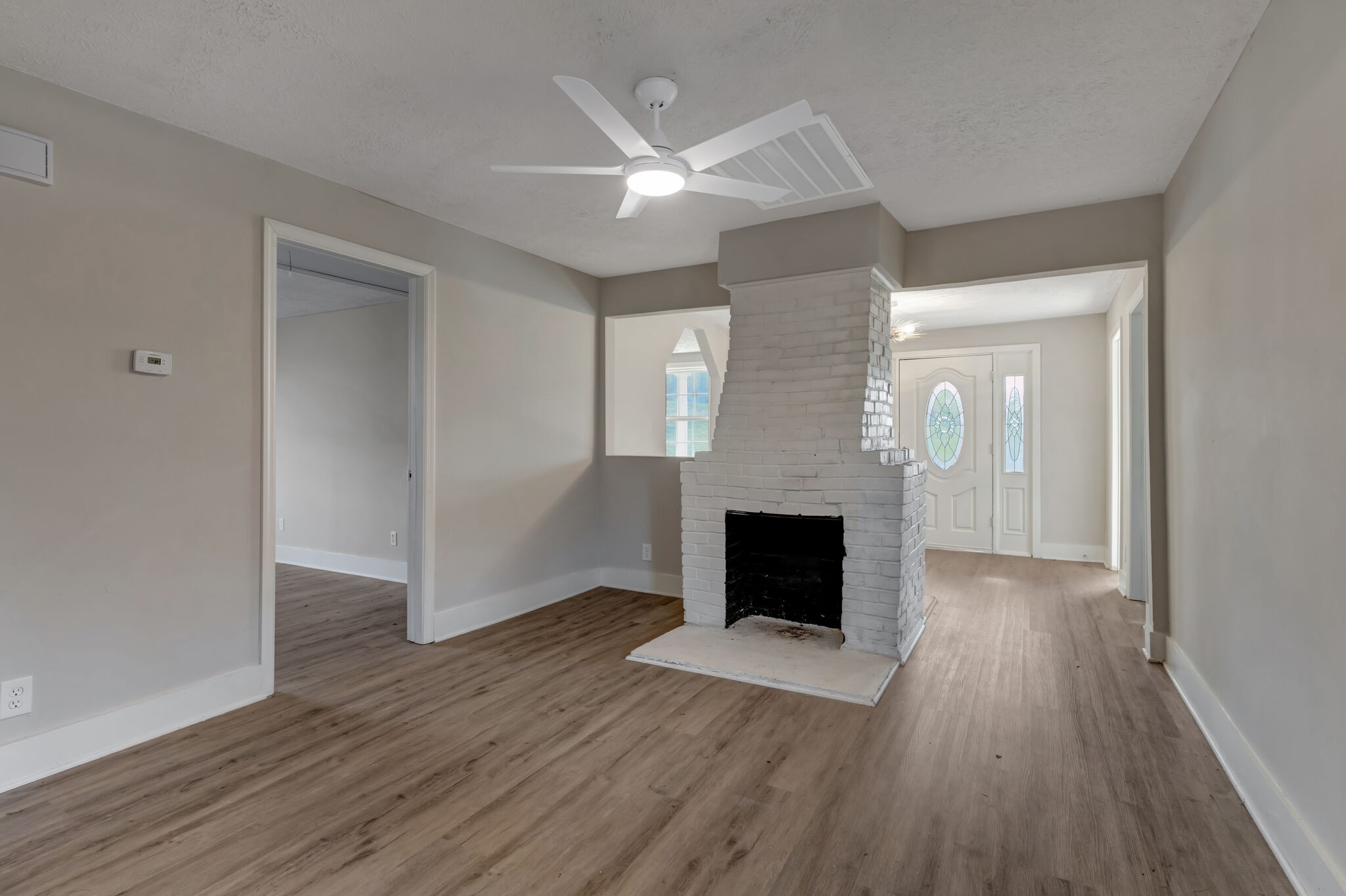 1225 Berea Church Road Lebanon, TN 37087 - Photo 5 of 26 wooden floor in an empty room with a fireplace