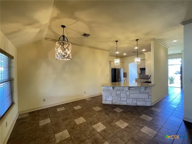 a view of a hallway with a chandelier