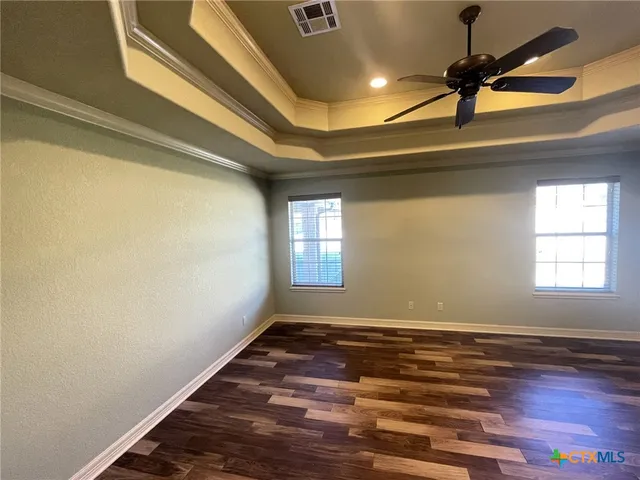 a view of room with window and ceiling fan