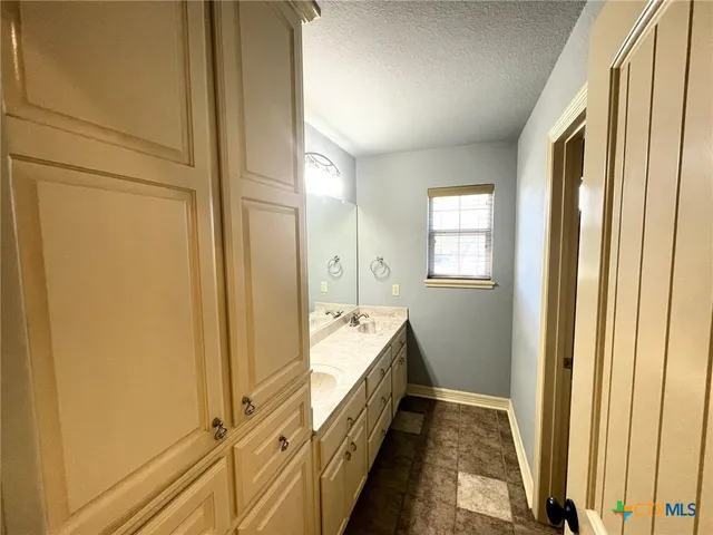a bathroom with a tub and shower
