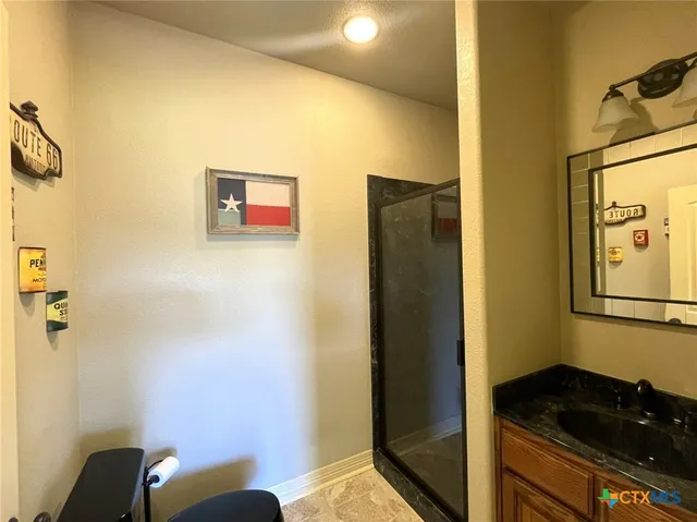 a bathroom with a sink and a mirror