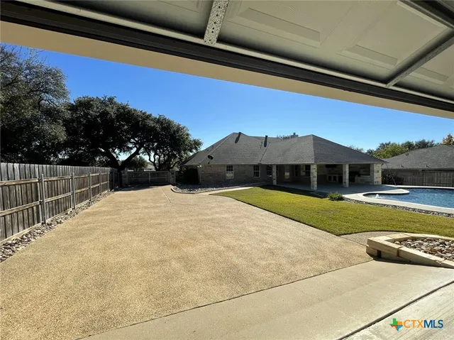 a view of swimming pool with an outdoor seating