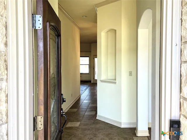 a view of a bathroom from a hallway