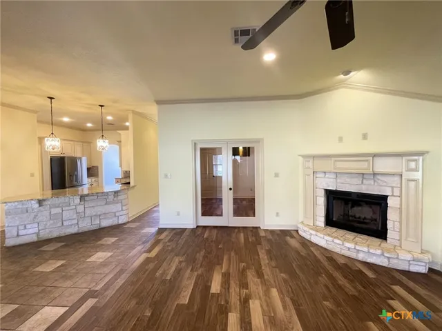 a view of an empty room and fire place