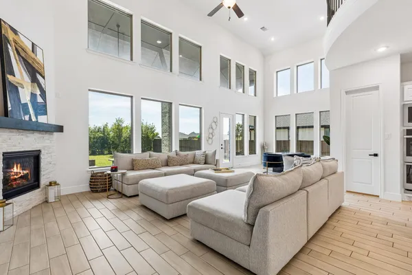 a living room with furniture and a fireplace