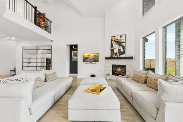 a living room with furniture and a fireplace