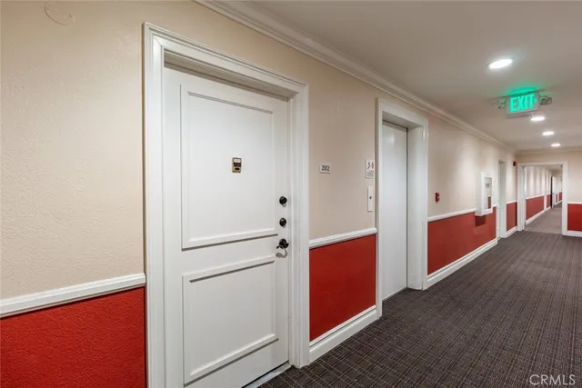 a view of hallway with cabinets