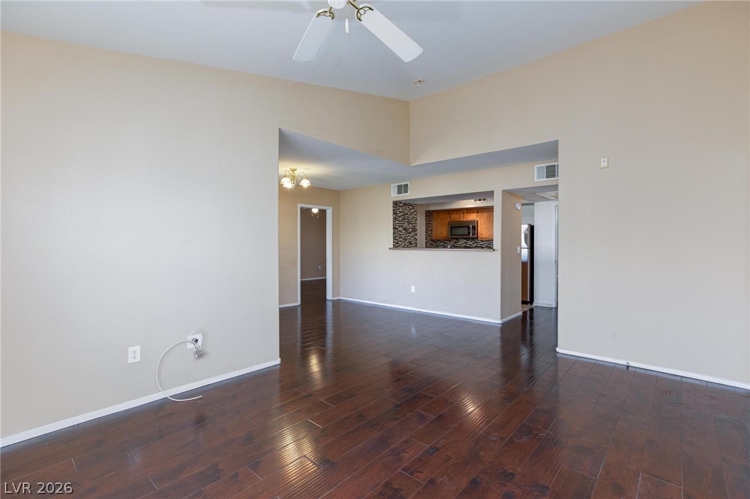 6650 West Warm Springs Road, Unit 2027 Las Vegas, NV 89118 - Photo 8 of 29 This inviting living area boasts rich hardwood floors and an open concept layout, perfect for daily living.