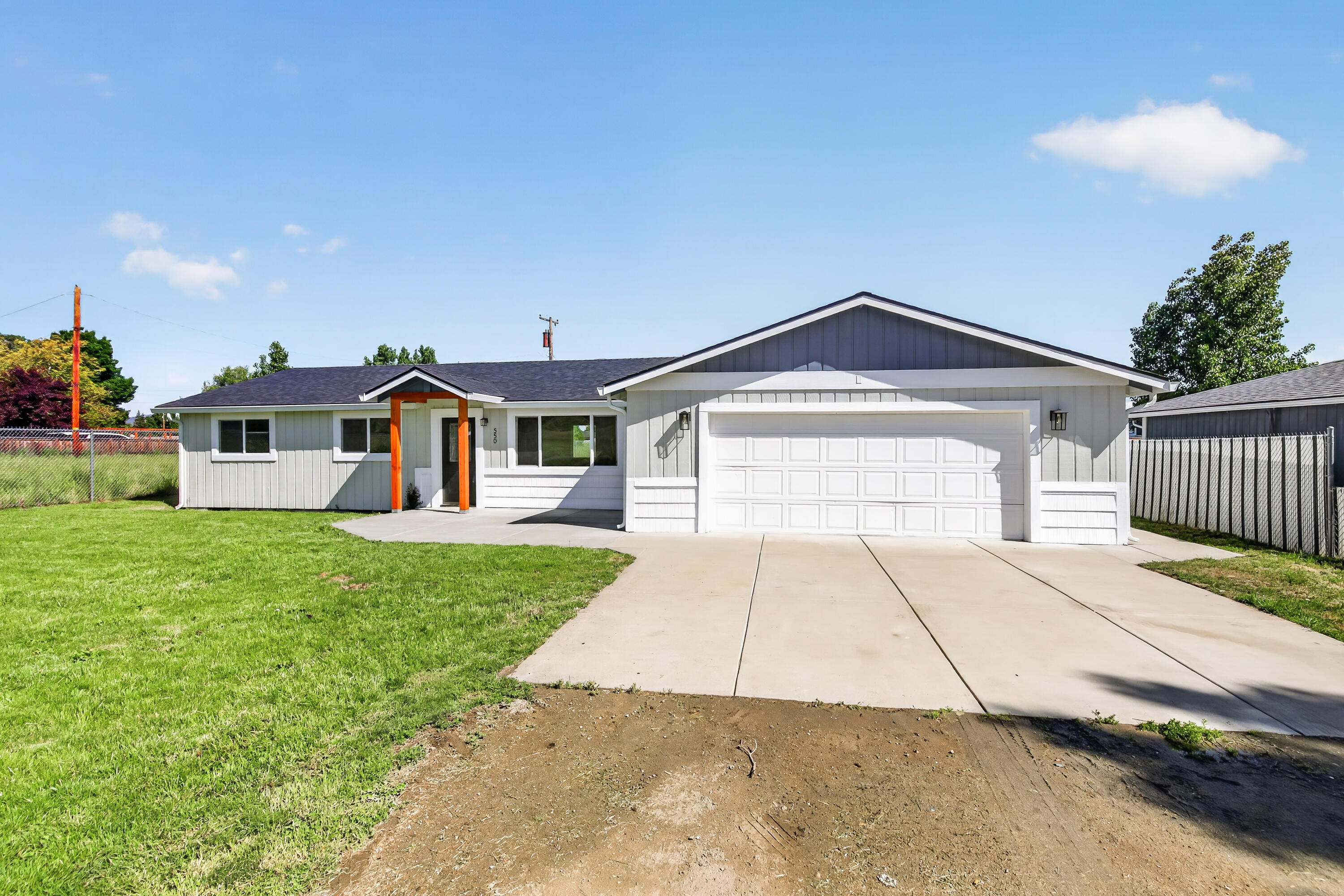 550 Experiment Station Road Medford, OR 97501 - Photo 1 of 27 a front view of a house with a yard and garage
