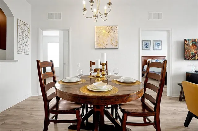 a dining room with furniture and window