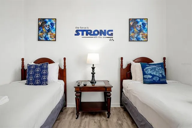 a bedroom with bed and a couch