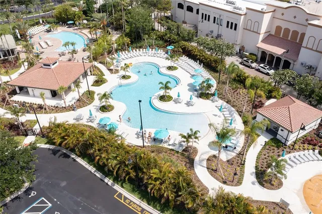 an aerial view of a house with a swimming pool