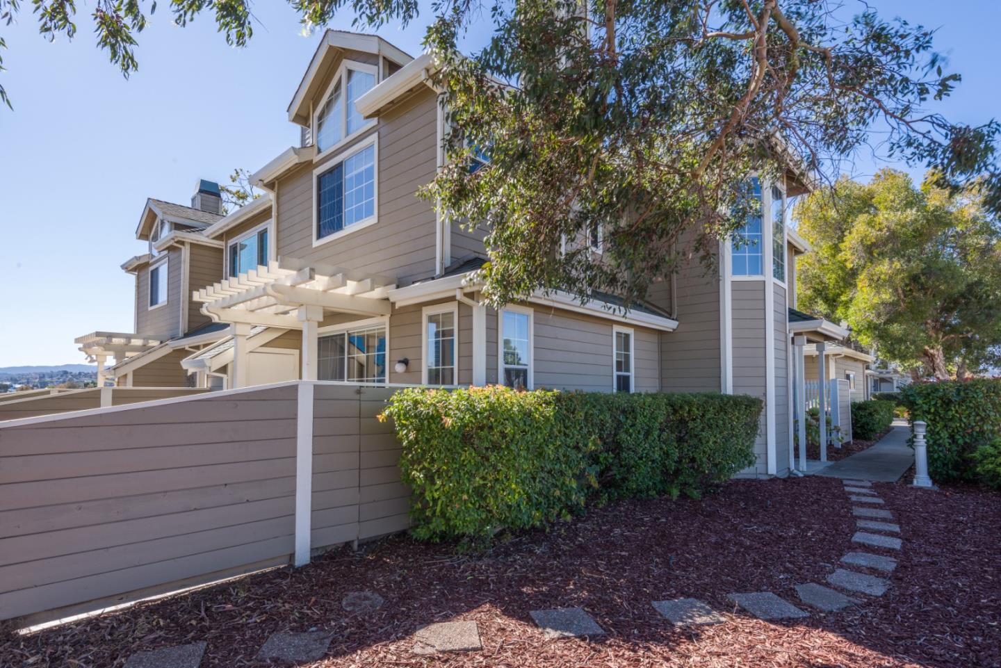 a view of a brick building next to a yard