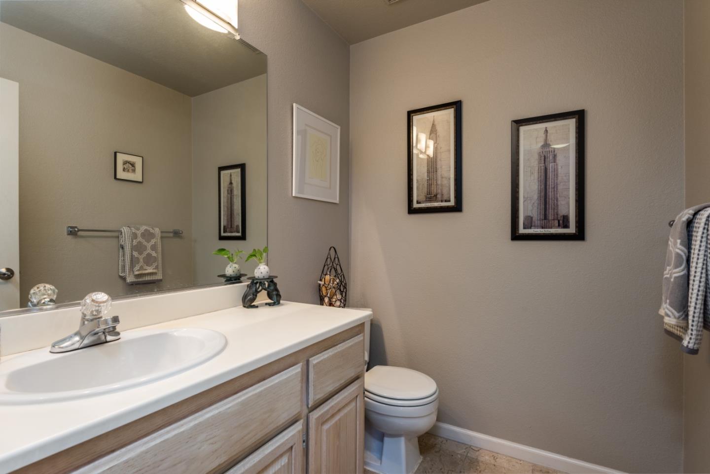 100 Farallon Drive Belmont, CA 94002 - Photo 13 of 29 a bathroom with a sink a toilet and mirror