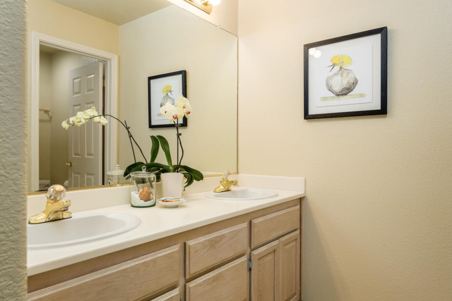 100 Farallon Drive Belmont, CA 94002 - Photo 15 of 29 a bathroom with a sink and a mirror