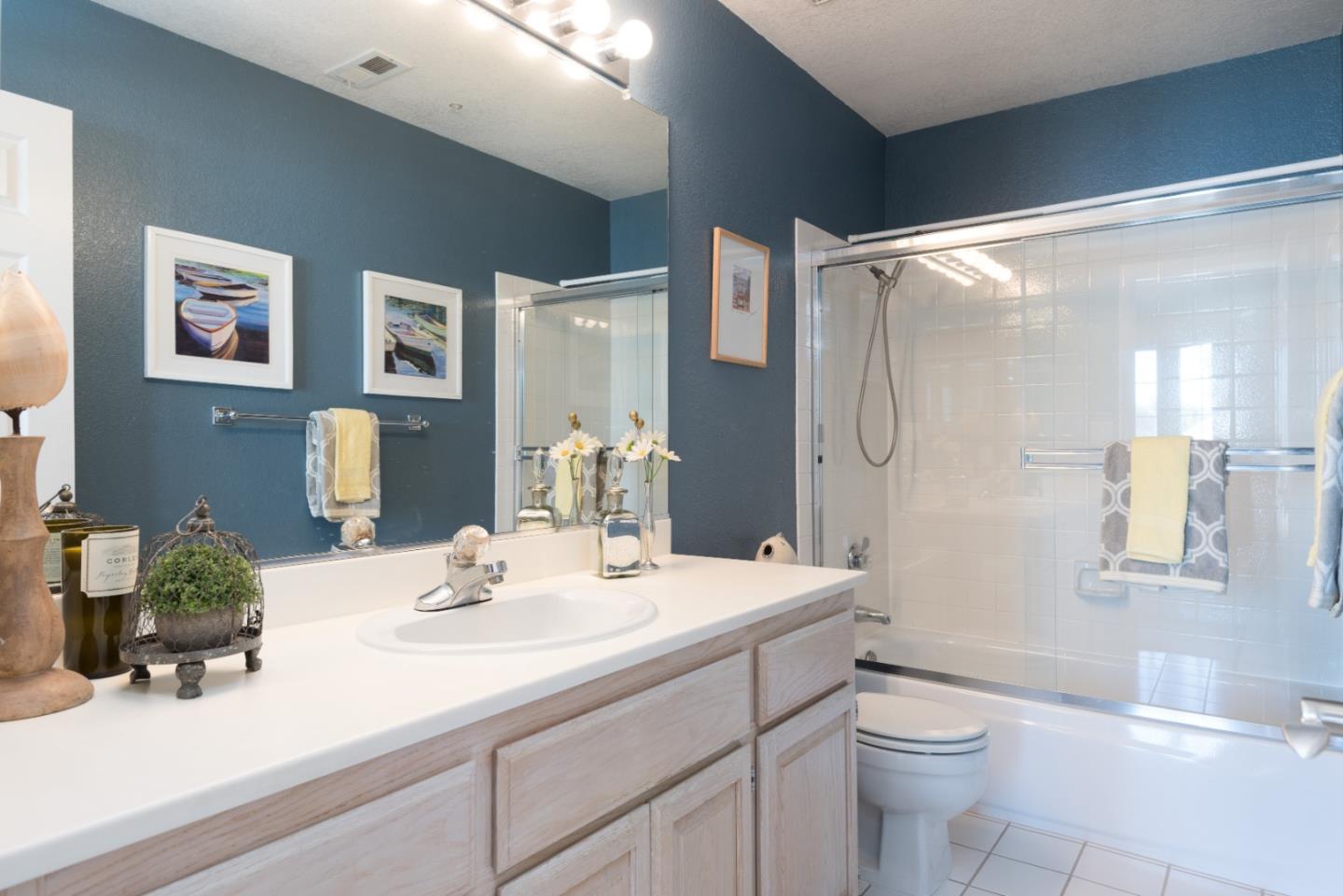 100 Farallon Drive Belmont, CA 94002 - Photo 17 of 29 a bathroom with a double vanity sink toilet and shower