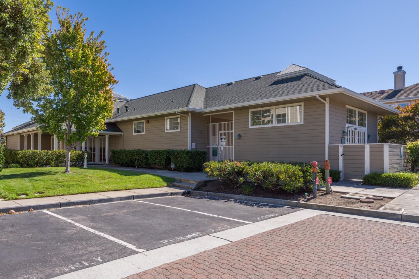 100 Farallon Drive Belmont, CA 94002 - Photo 21 of 29 a front view of a house with a yard and trees