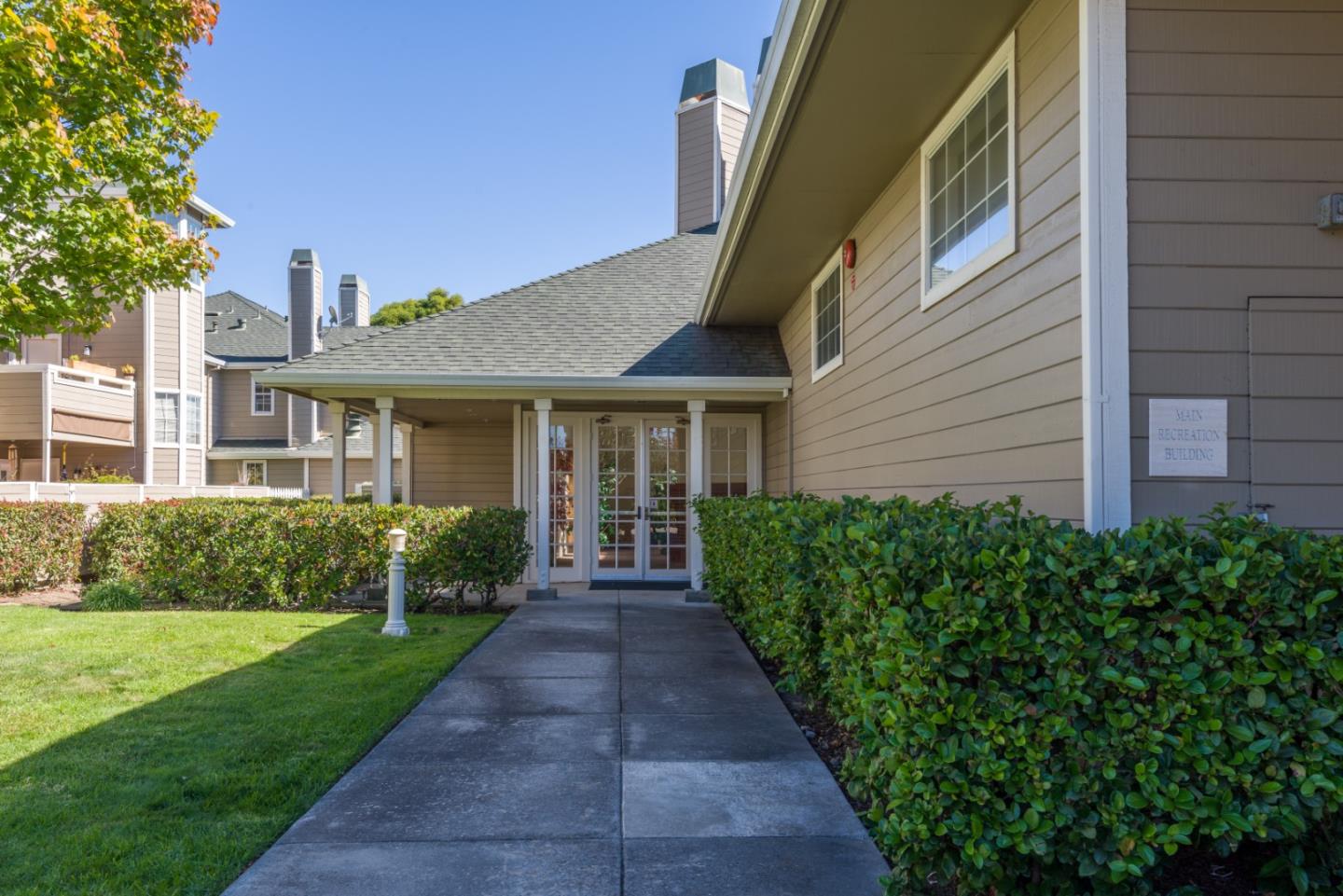 100 Farallon Drive Belmont, CA 94002 - Photo 22 of 29 a front view of a house with a yard