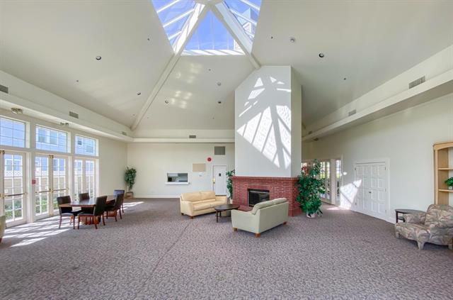 100 Farallon Drive Belmont, CA 94002 - Photo 23 of 29 a living room with furniture and a large window