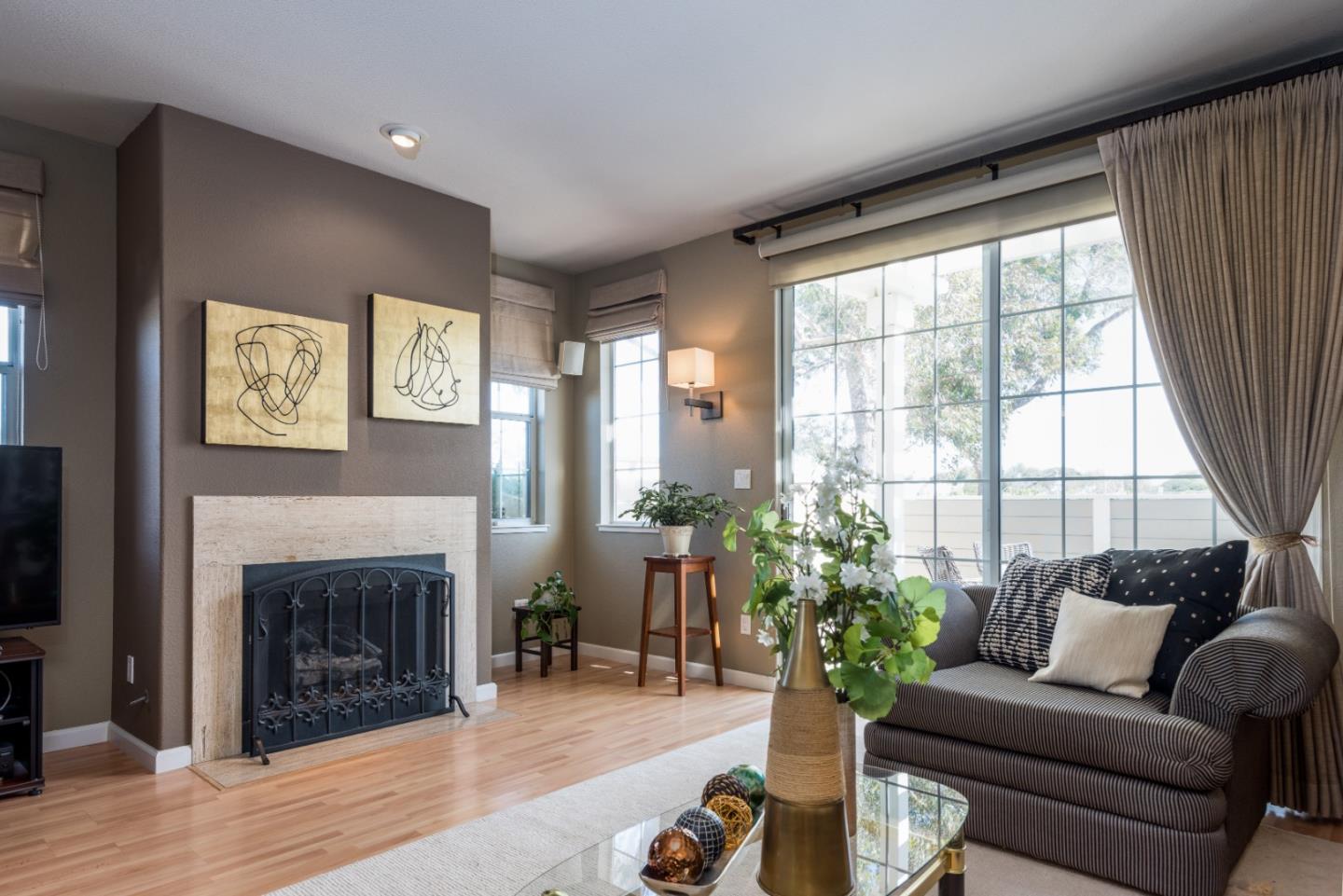 100 Farallon Drive Belmont, CA 94002 - Photo 7 of 29 a living room with furniture large window and a fireplace