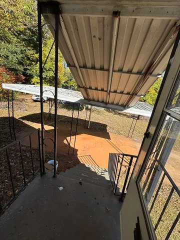 a view of a hallway view with wooden floor and staircase