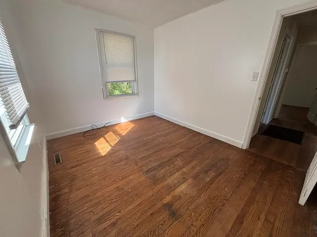 a bathroom with a sink toilet and mirror