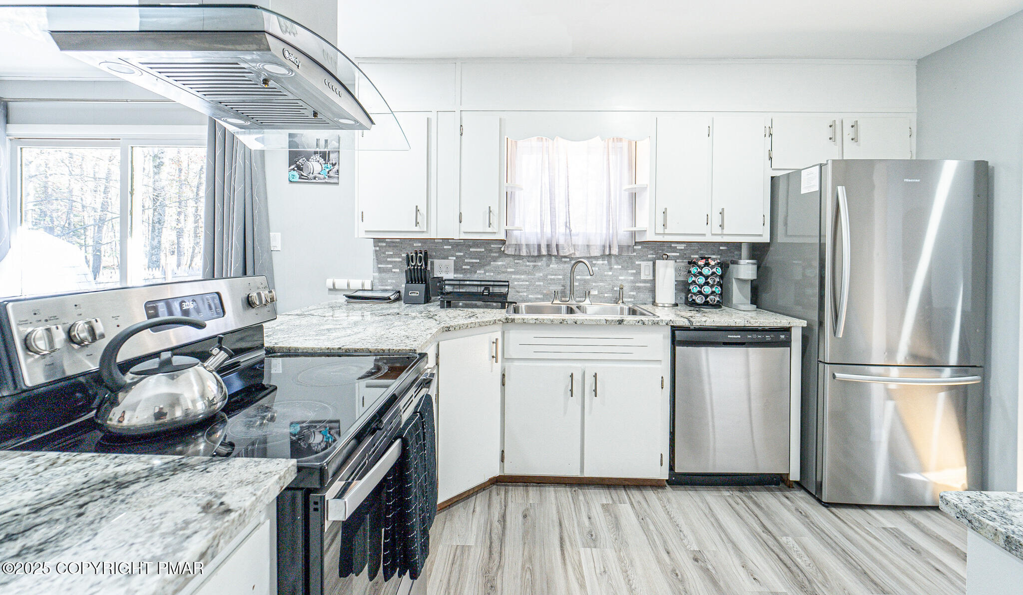 2332 Highway 940 Pocono Summit, PA 18346 - Photo 11 of 65 a kitchen with a sink stove and refrigerator