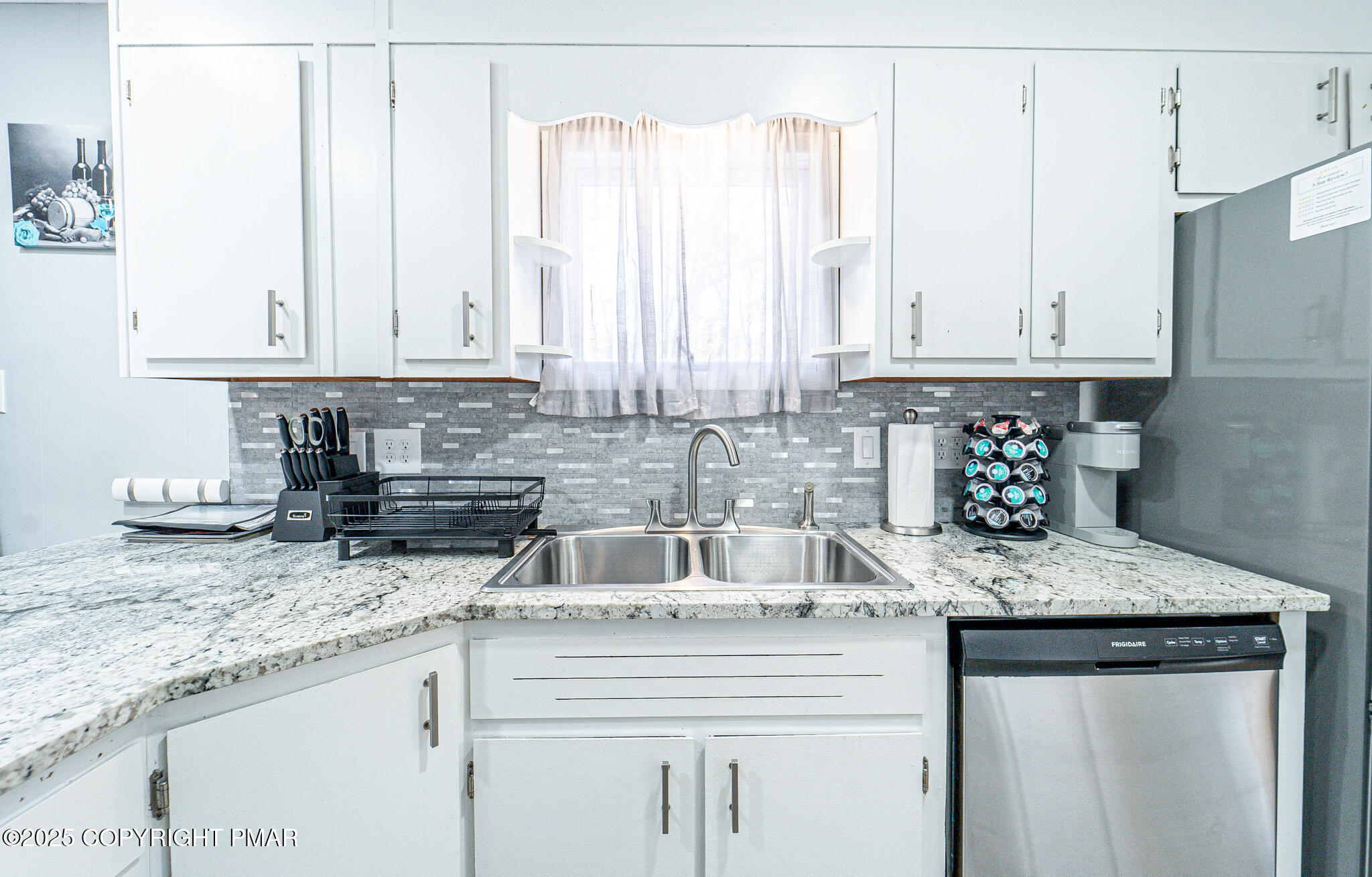 2332 Highway 940 Pocono Summit, PA 18346 - Photo 12 of 65 a kitchen with granite countertop a sink a stove and cabinets