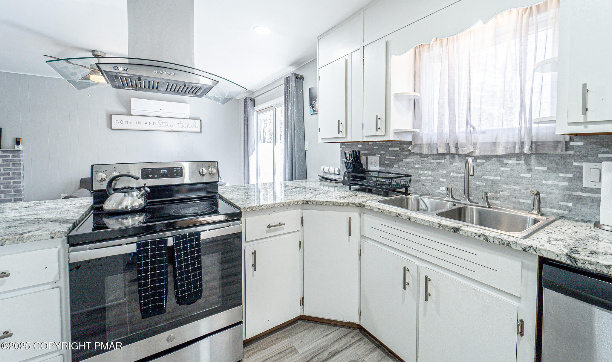 2332 Highway 940 Pocono Summit, PA 18346 - Photo 13 of 65 a kitchen with a sink stove top oven and cabinets