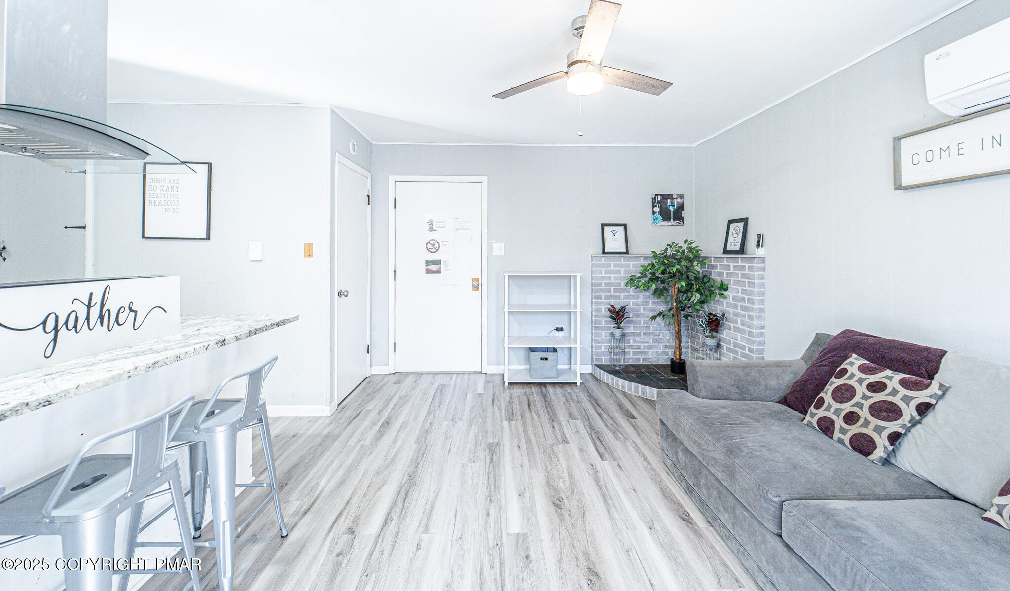 2332 Highway 940 Pocono Summit, PA 18346 - Photo 17 of 65 a living room with furniture and a potted plant