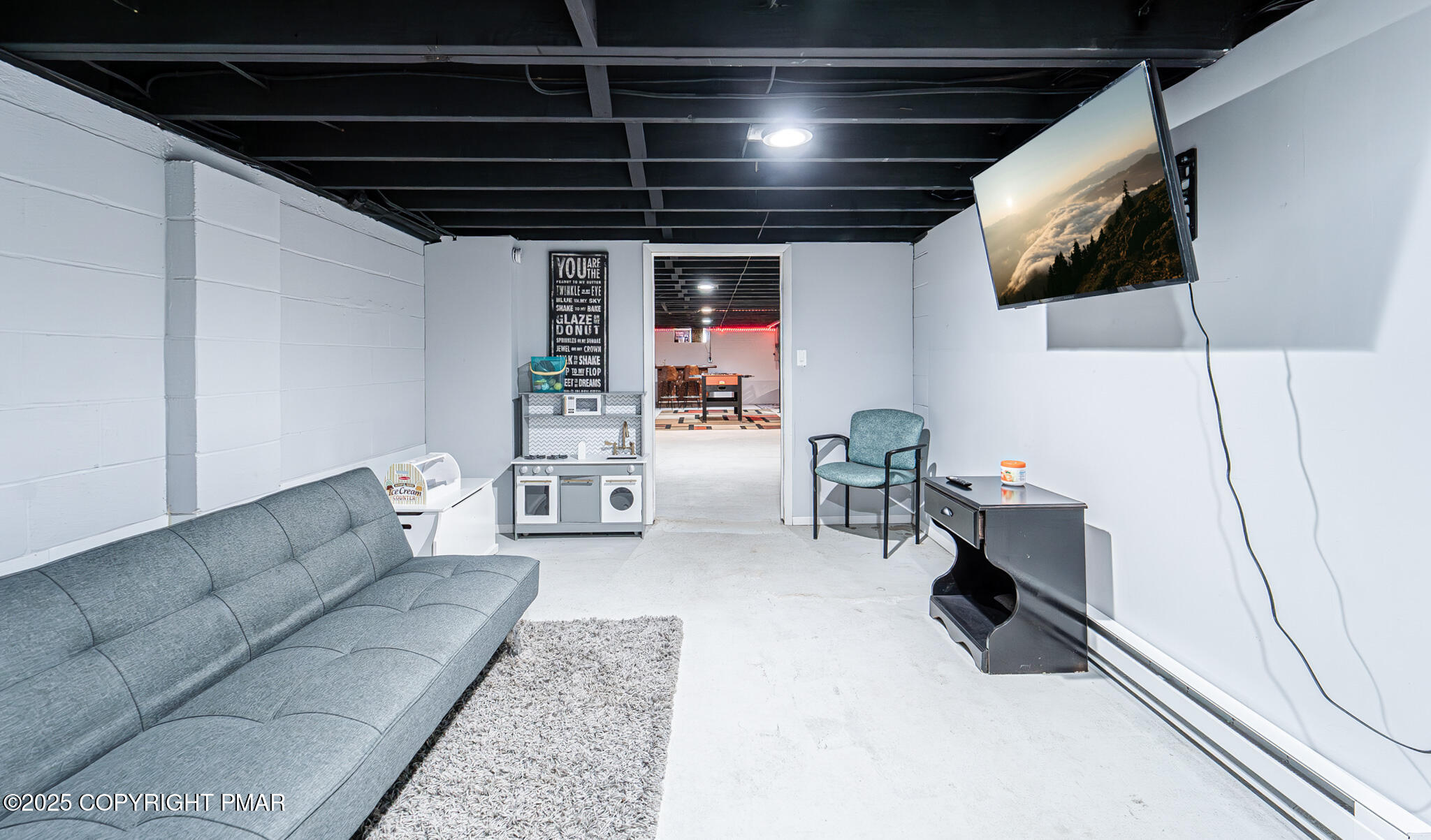 2332 Highway 940 Pocono Summit, PA 18346 - Photo 35 of 65 a living room with furniture and a flat screen tv