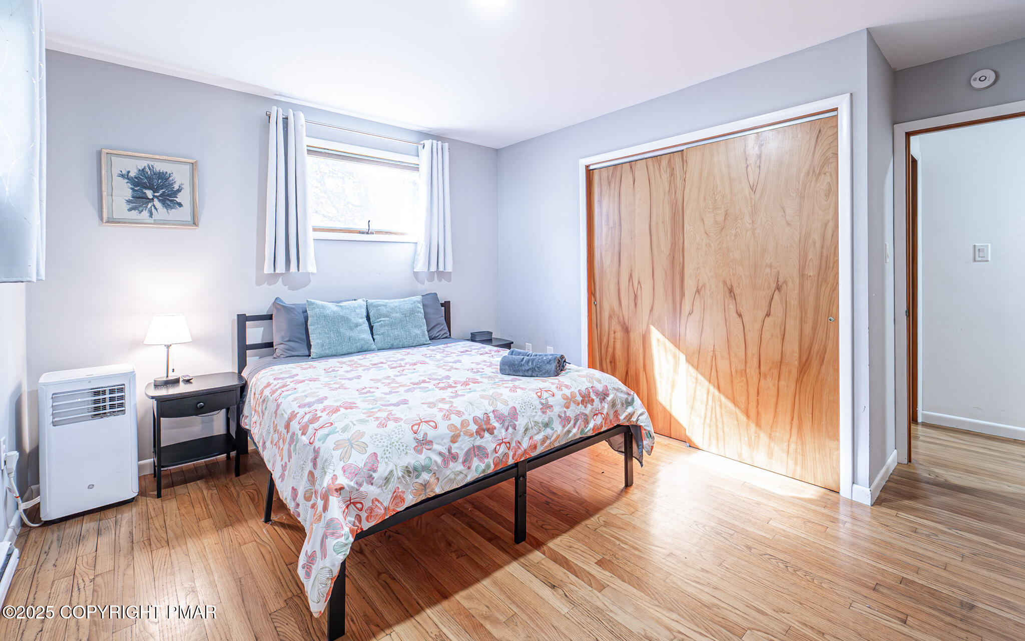 2332 Highway 940 Pocono Summit, PA 18346 - Photo 38 of 65 a bedroom with a bed and wooden floor