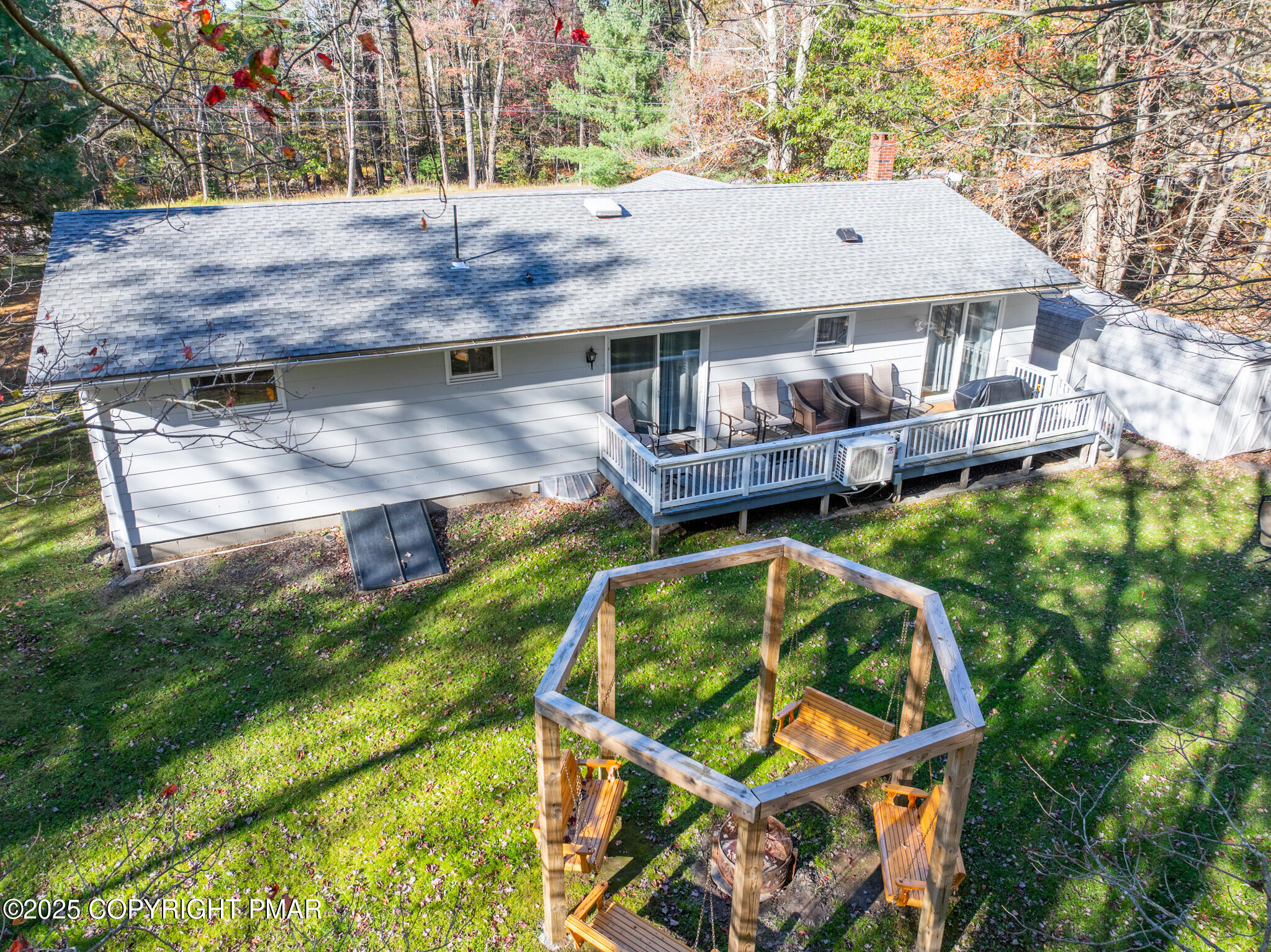 2332 Highway 940 Pocono Summit, PA 18346 - Photo 5 of 65 an aerial view of a house with swimming pool and porch
