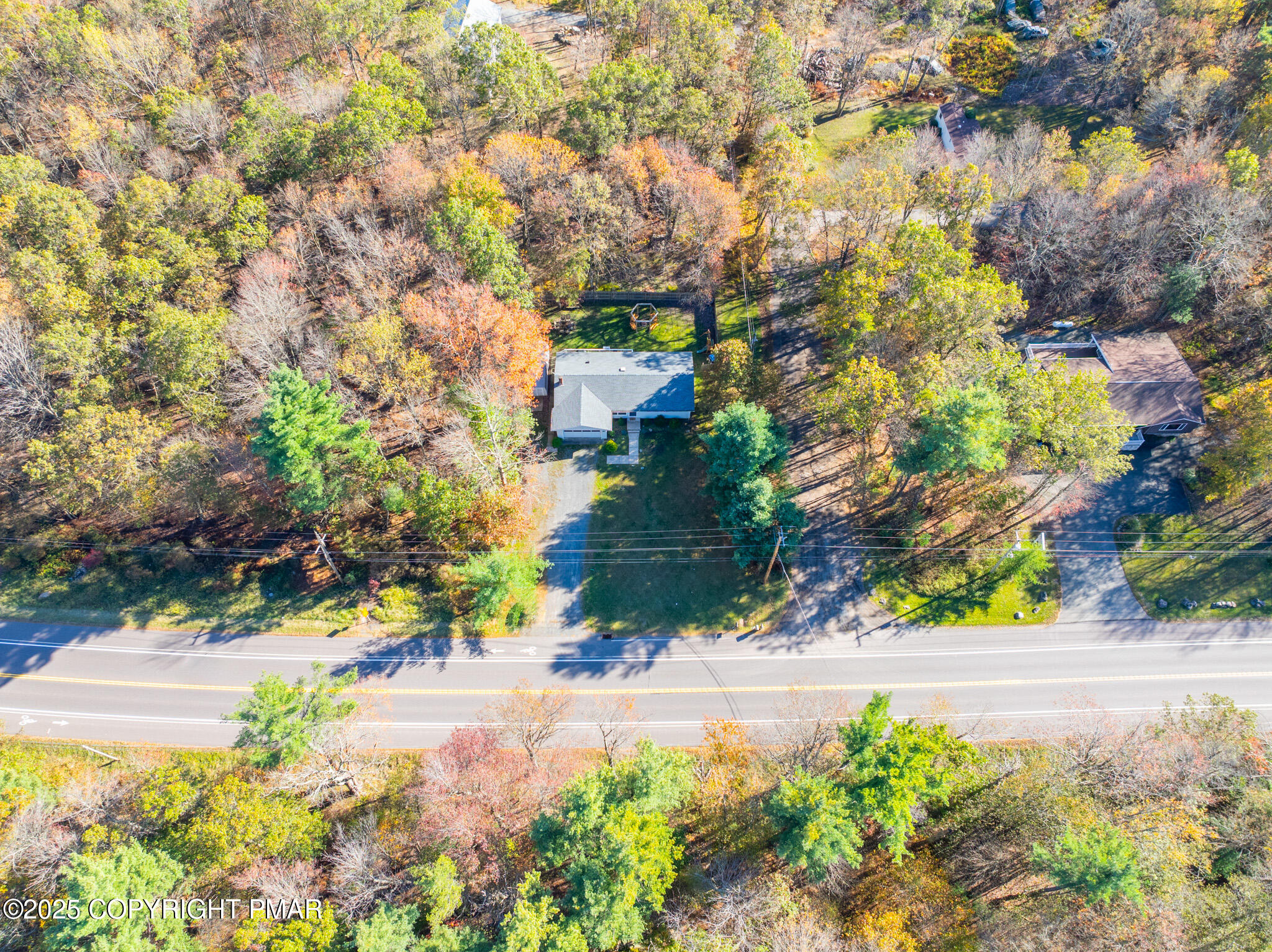 2332 Highway 940 Pocono Summit, PA 18346 - Photo 8 of 65 a view of a yard with plants and large trees