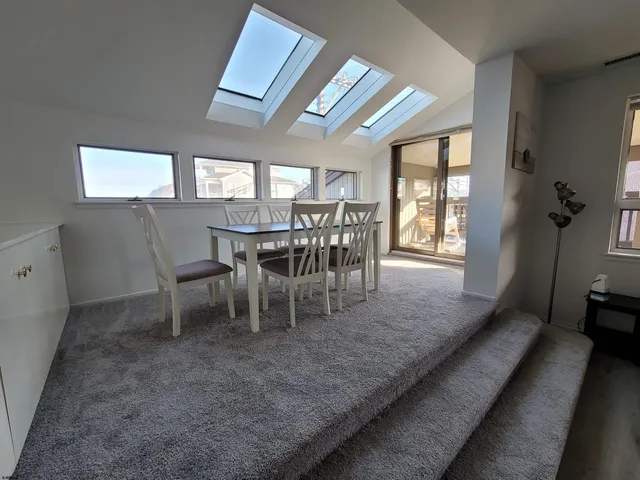 a bedroom with a bed and flat screen tv