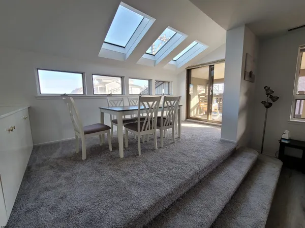 a bedroom with bed and window