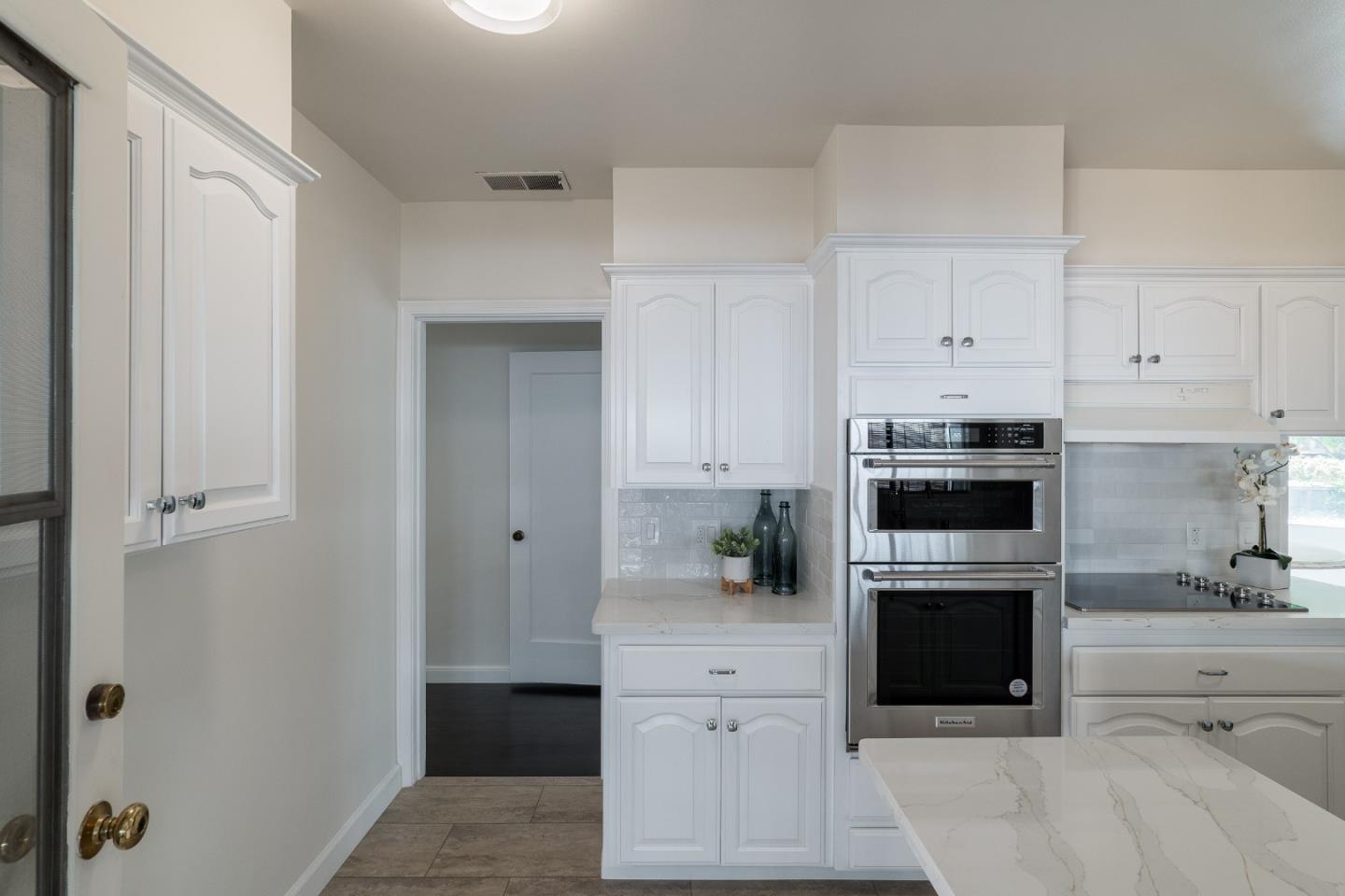 340 Dwight Road Burlingame, CA 94010 - Photo 14 of 29 a kitchen with cabinets appliances and a counter space