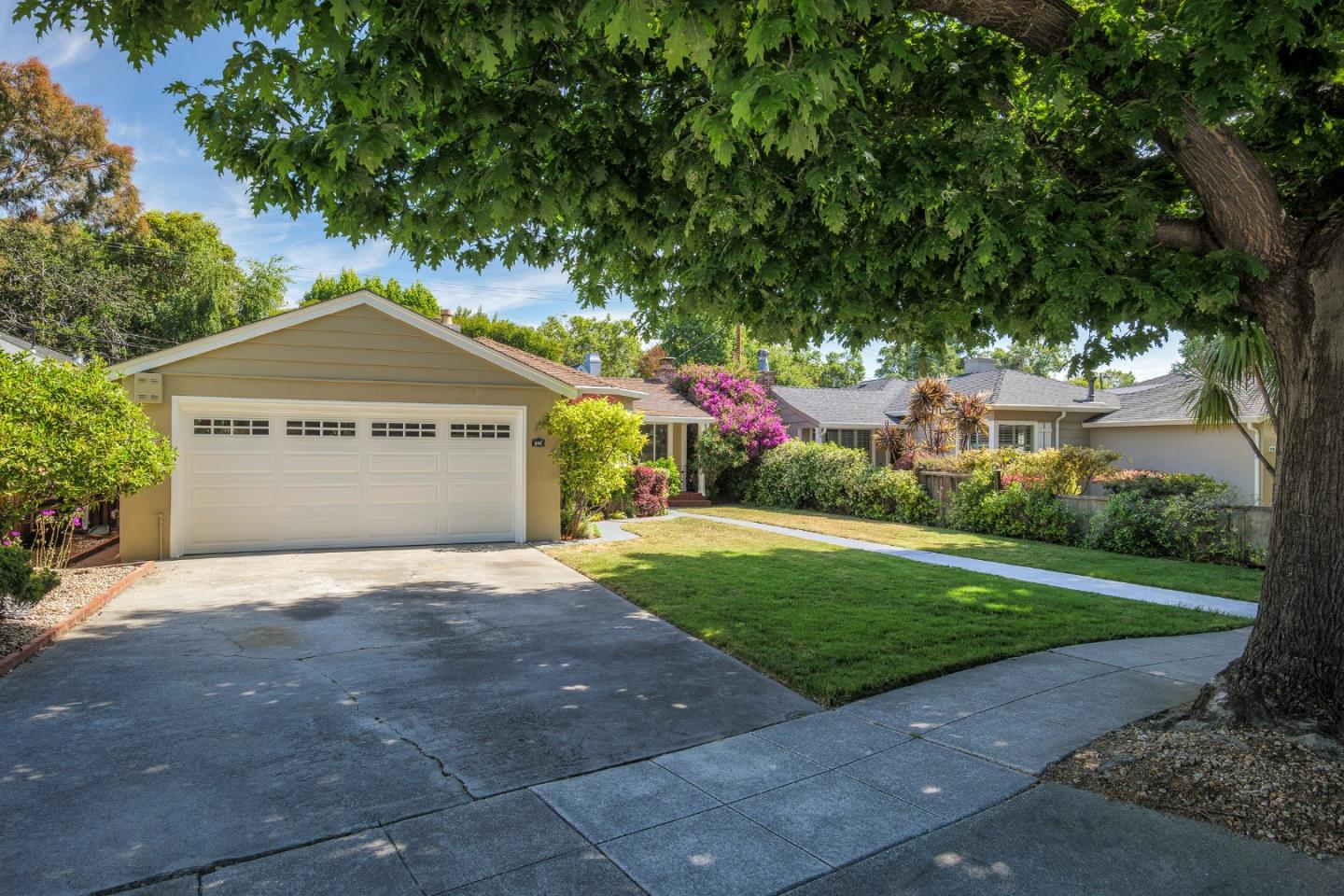 340 Dwight Road Burlingame, CA 94010 - Photo 3 of 29 a front view of a house with a yard and garage