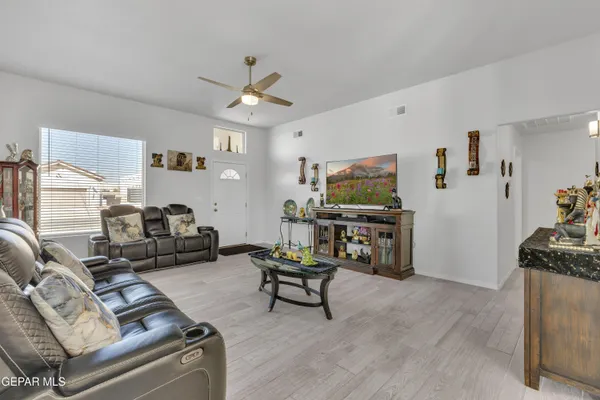 a living room with furniture and a flat screen tv