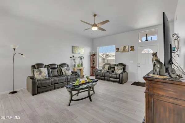 a living room with furniture and a flat screen tv