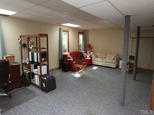 8829 Woodyhill Road Raleigh, NC 27613 - Photo 11 of 21 Great space for a pool table, rainy day play area for children, or an additonal famly room. Basement