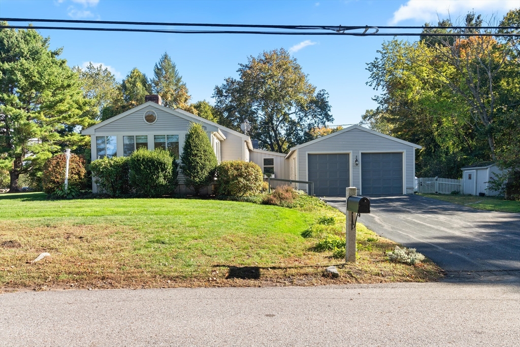 152 Coburn Road Berlin, MA 01503 - Photo 2 of 40 a front view of a house with garden