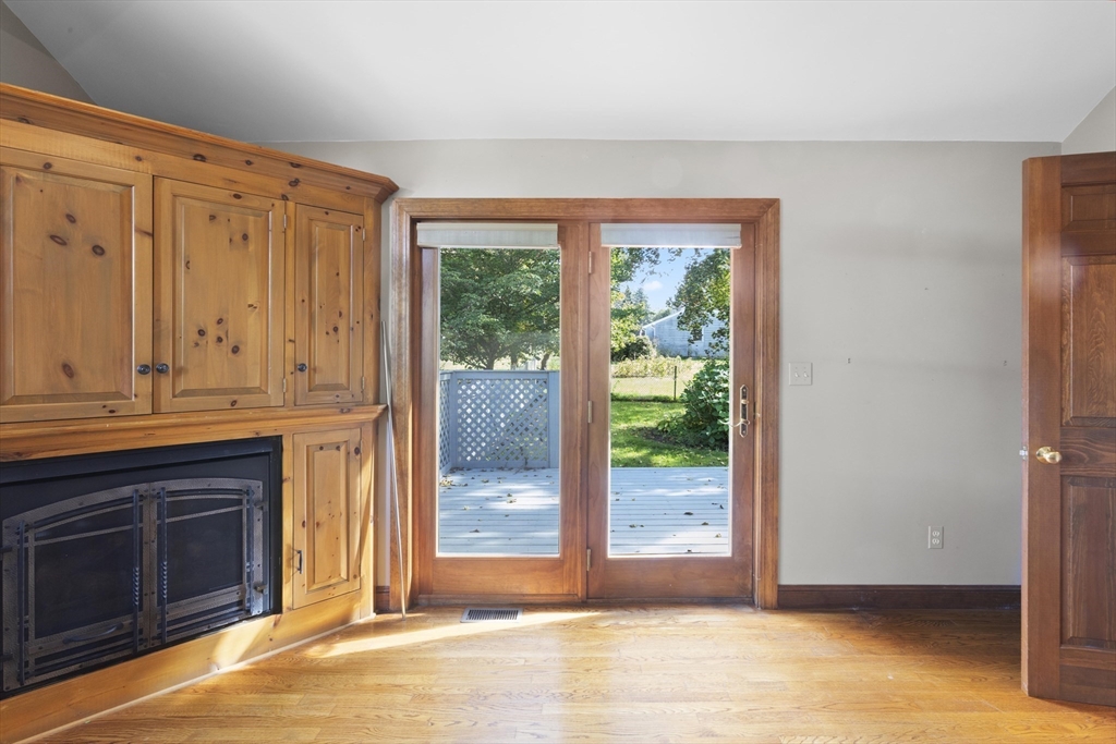 152 Coburn Road Berlin, MA 01503 - Photo 21 of 40 a view of empty room with wooden floor and fan