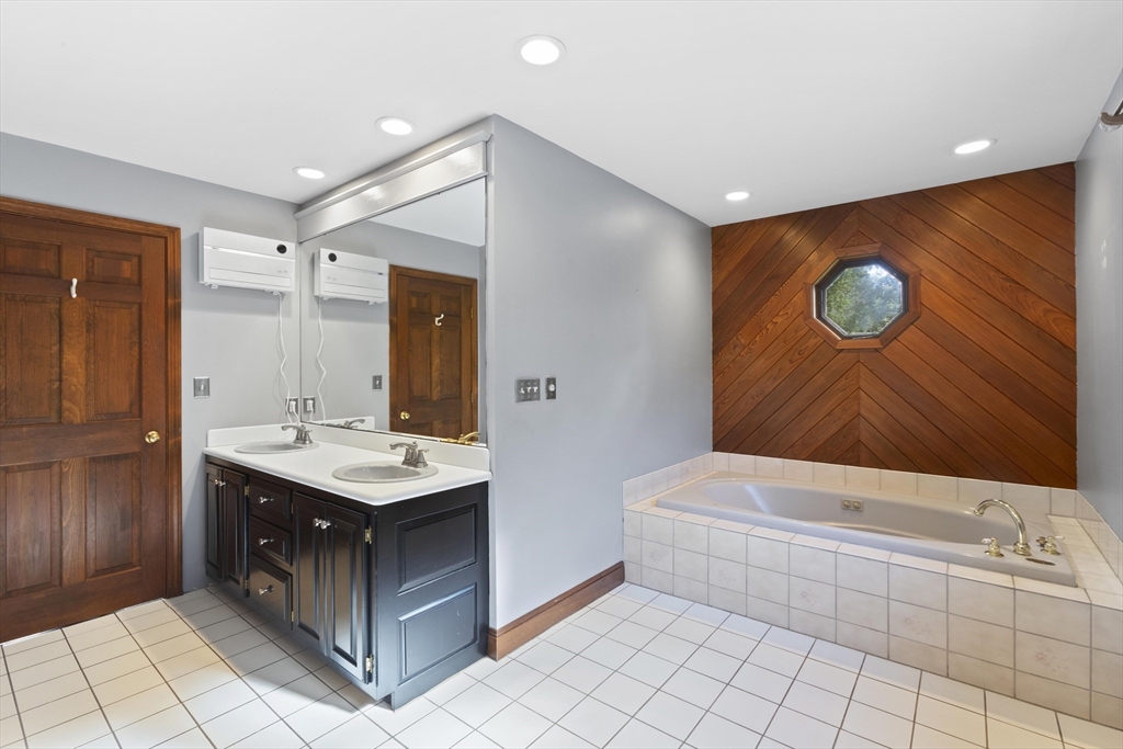 152 Coburn Road Berlin, MA 01503 - Photo 23 of 40 a bathroom with a sink a toilet and mirror