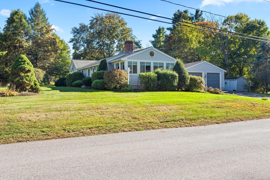 152 Coburn Road Berlin, MA 01503 - Photo 38 of 40 a front view of a house with a yard