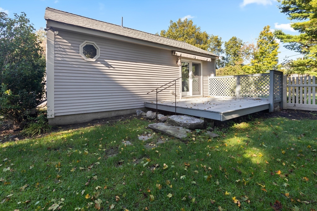 152 Coburn Road Berlin, MA 01503 - Photo 39 of 40 a view of a backyard with plants and large tree