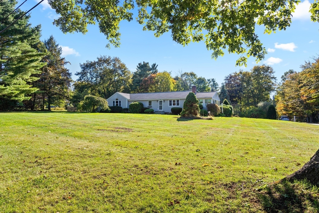 152 Coburn Road Berlin, MA 01503 - Photo 4 of 40 a view of a swimming pool with an outdoor seating and a yard