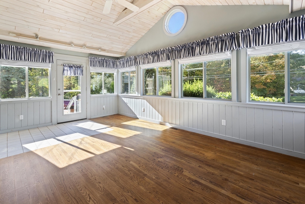152 Coburn Road Berlin, MA 01503 - Photo 8 of 40 a view of an empty room with wooden floor and windows