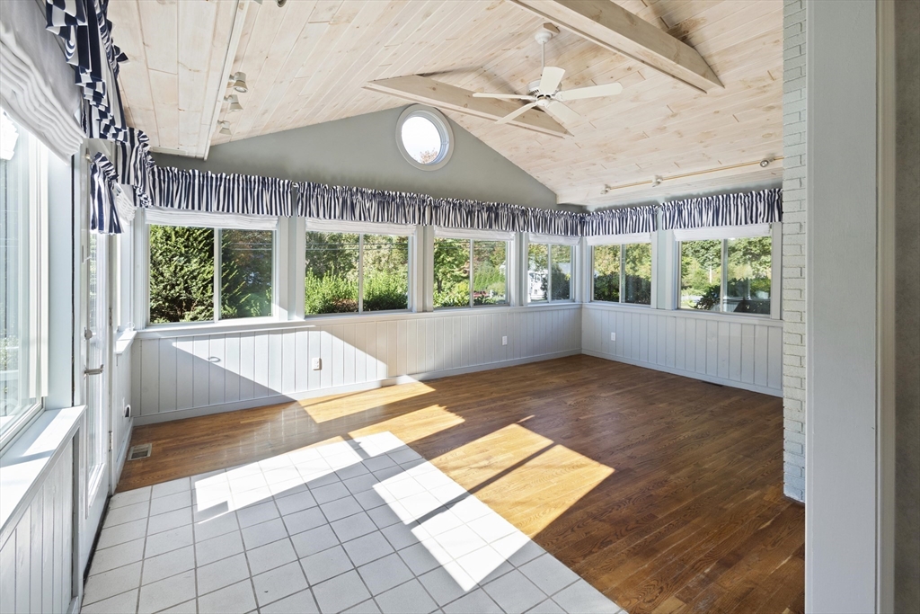 152 Coburn Road Berlin, MA 01503 - Photo 9 of 40 a view of an empty room with a floor to ceiling window and outdoor view