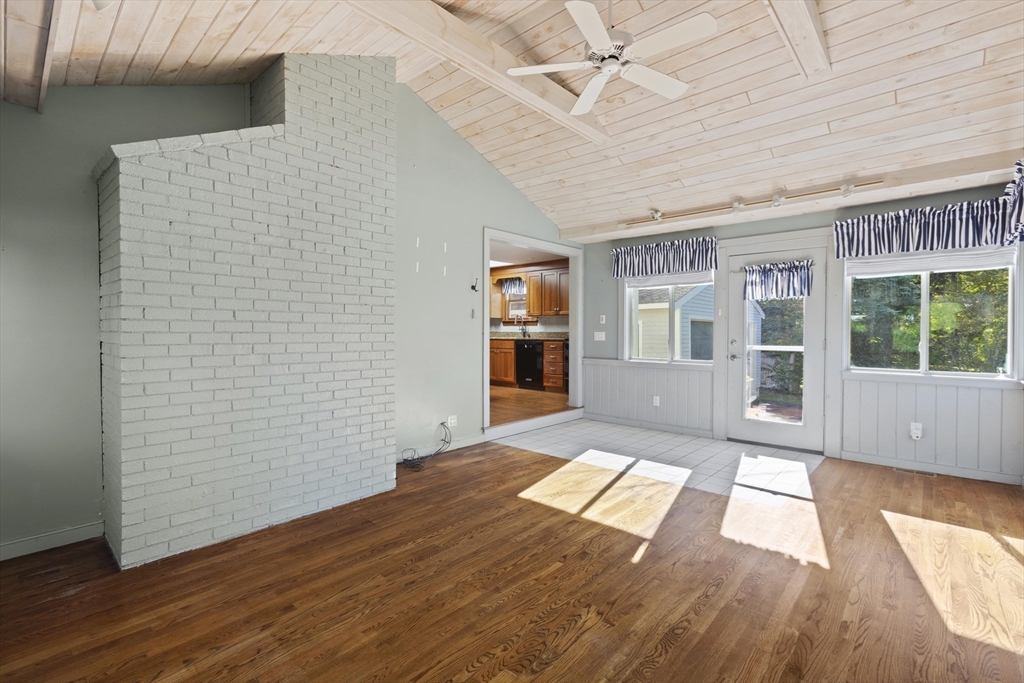 152 Coburn Road Berlin, MA 01503 - Photo 10 of 40 a view of an empty room with wooden floor and a window